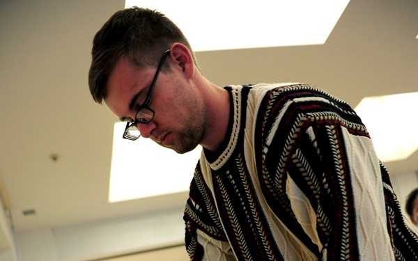 Volunteers package patron's presents