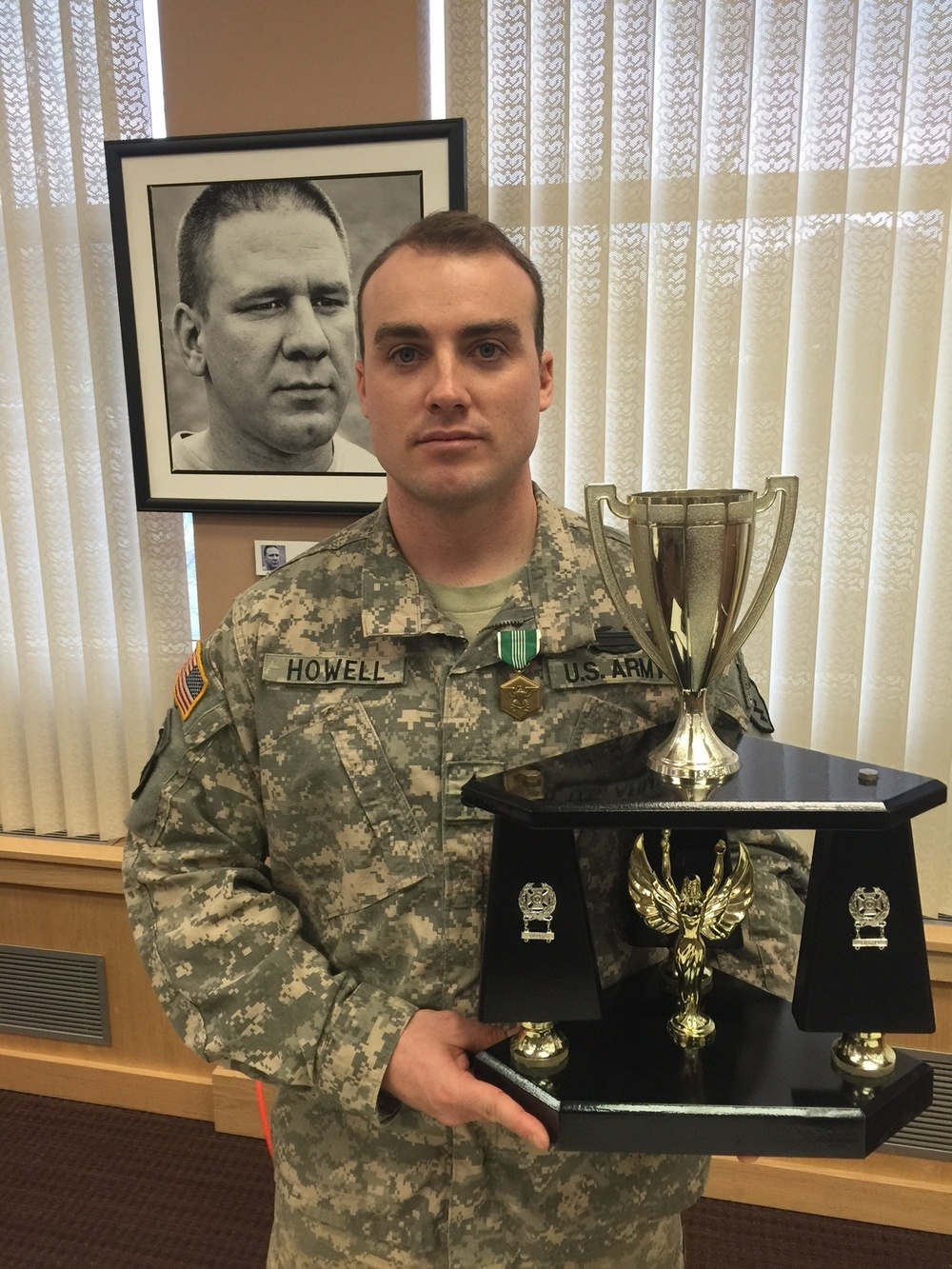 Staff Sgt. Jean-Noel Howell receives an award for top performer
