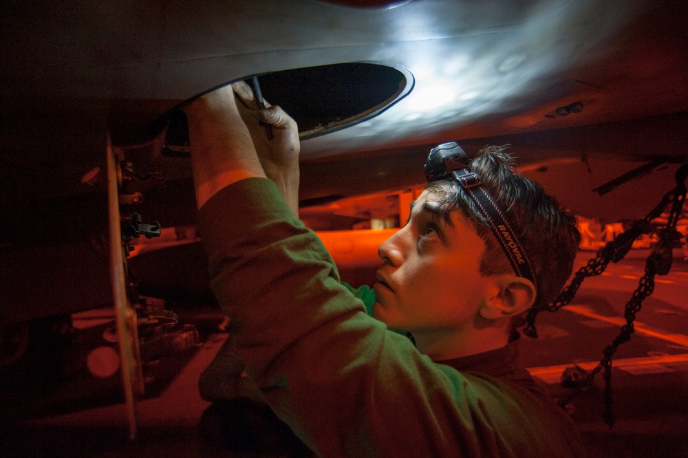 USS Carl Vinson Sailors conduct aircraft maintenance