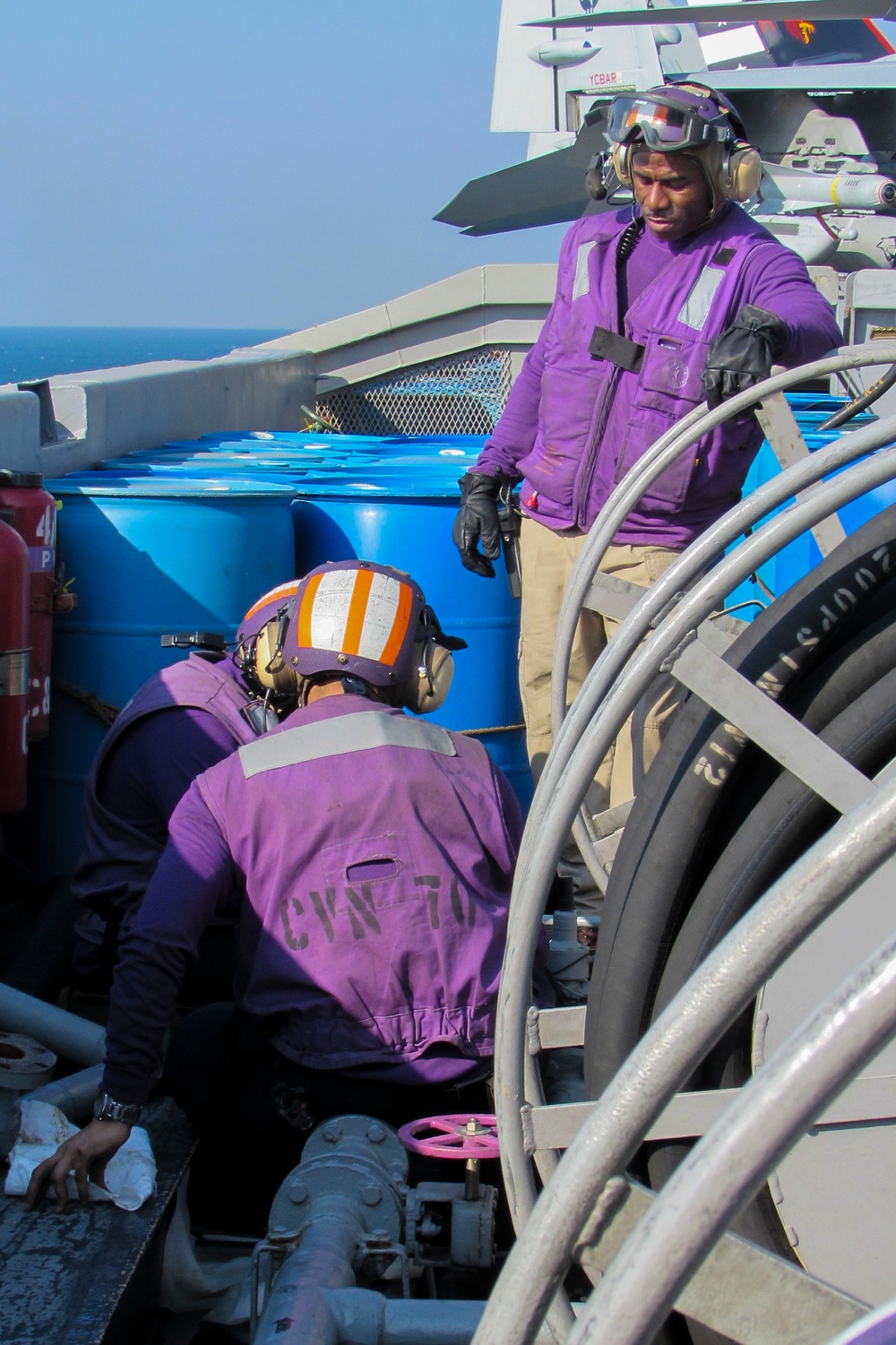 USS Carl Vinson Sailors repair a fueling station swing joint