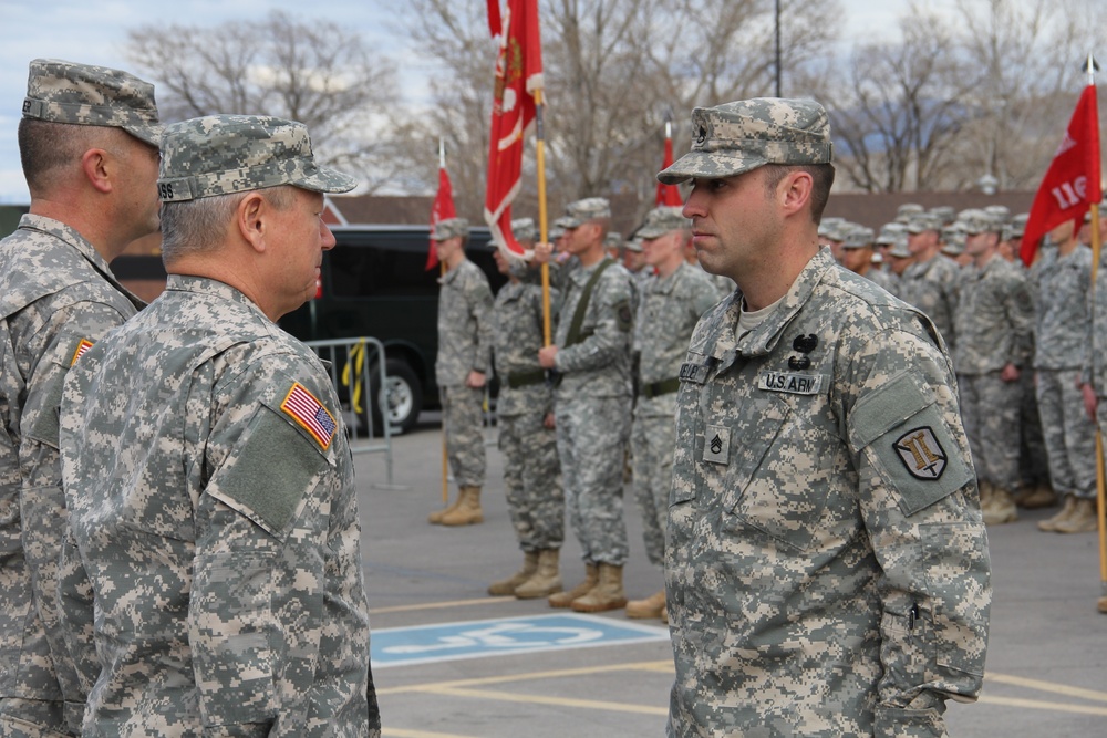 Gen. Grass presents Soldiers Medal to Staff Sgt. Robert Kelley for heroism at Camp Williams Dec. 6, 2014