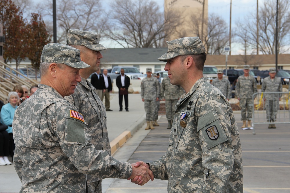 Gen. Grass presents Soldiers Medal to Staff Sgt. Robert Kelley for heroism at Camp Williams Dec. 6, 2014