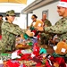 Camp Lemonnier religious programs specialists hand out Christmas gifts