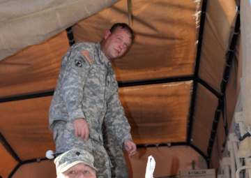733rd Soldiers join community to fill Stockings for Soldiers
