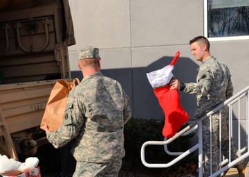 733rd Soldiers join community to fill Stockings for Soldiers