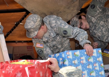 733rd Soldiers join community to fill Stockings for Soldiers