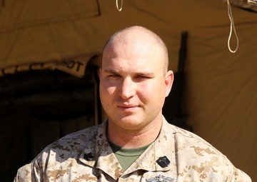 Corpsman uses environment for medical treatment