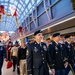 Military service members salute Gold Star children aboard the Snowball Express
