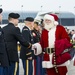 Military service members salute Gold Star children aboard the Snowball Express