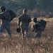 US Army Soldiers walk back to rally point after jump