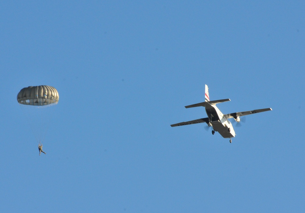 US Army paratrooper descends from aircraft