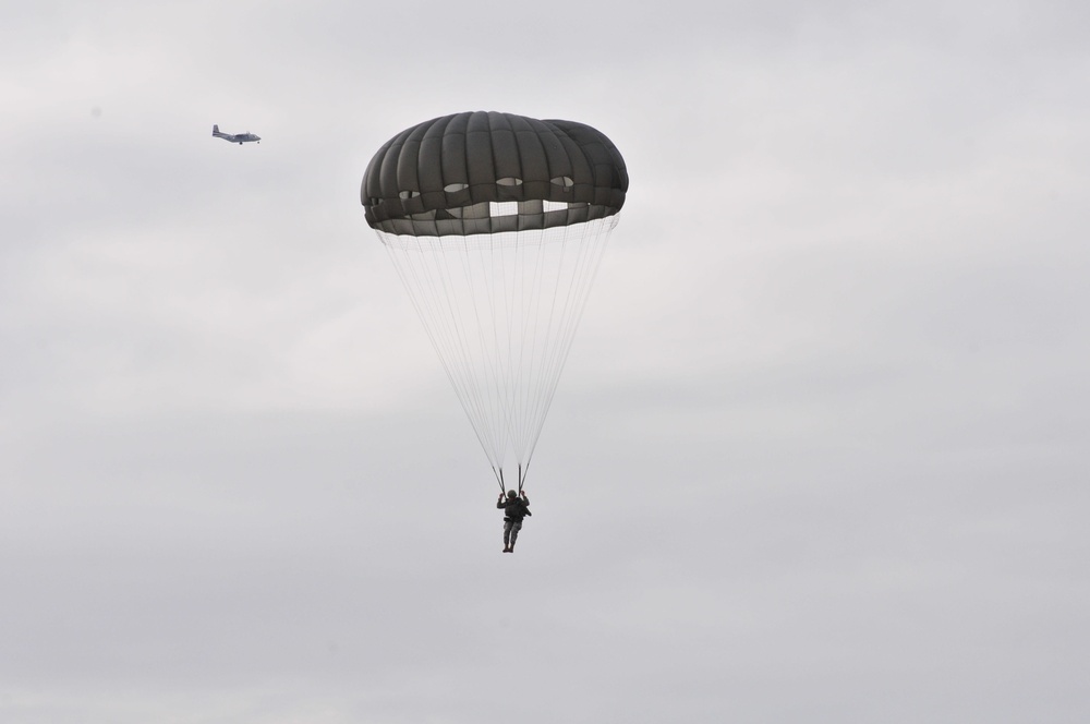 US Army paratrooper descends from aircraft