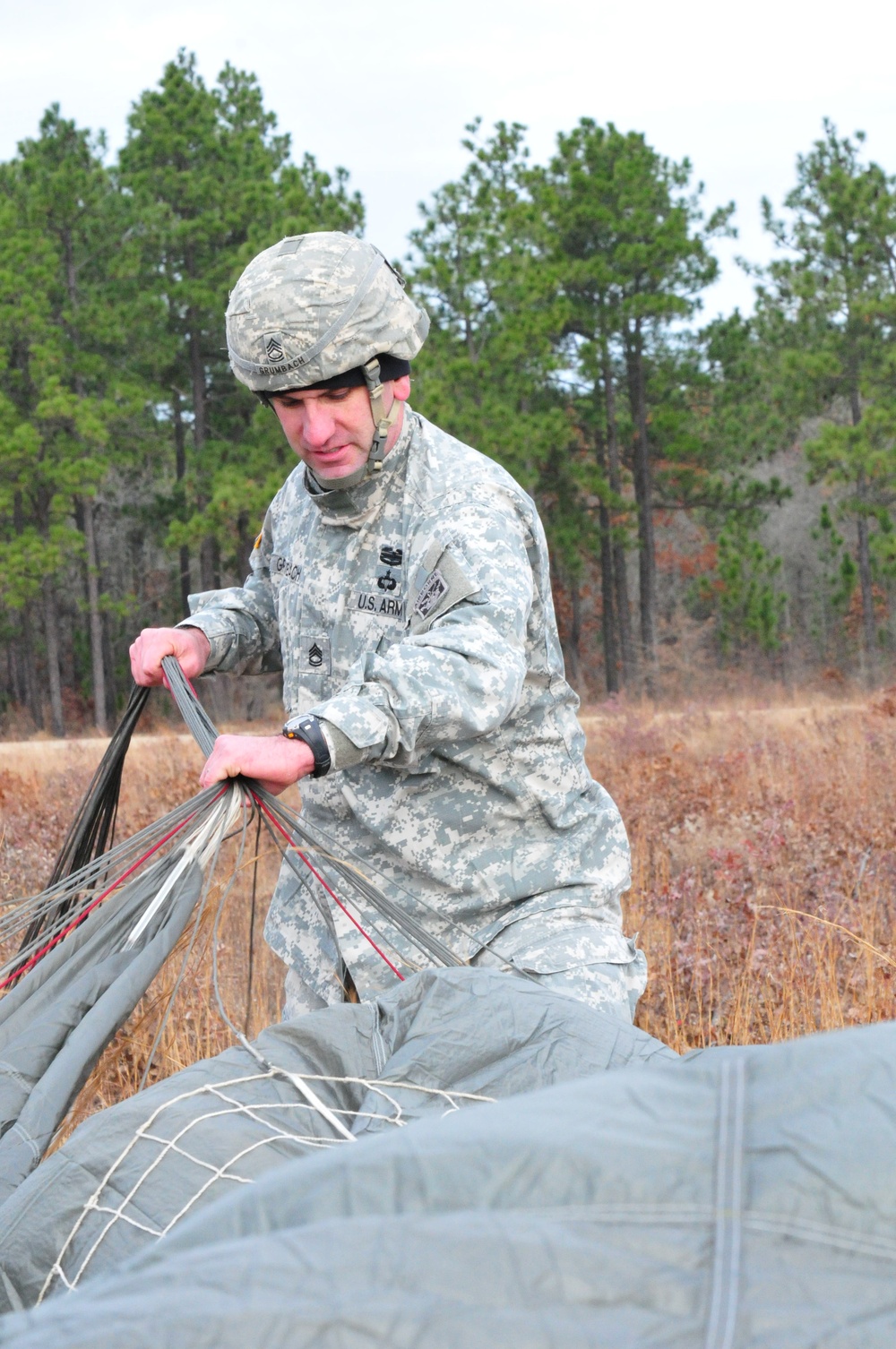US Army paratrooper recovers parachute