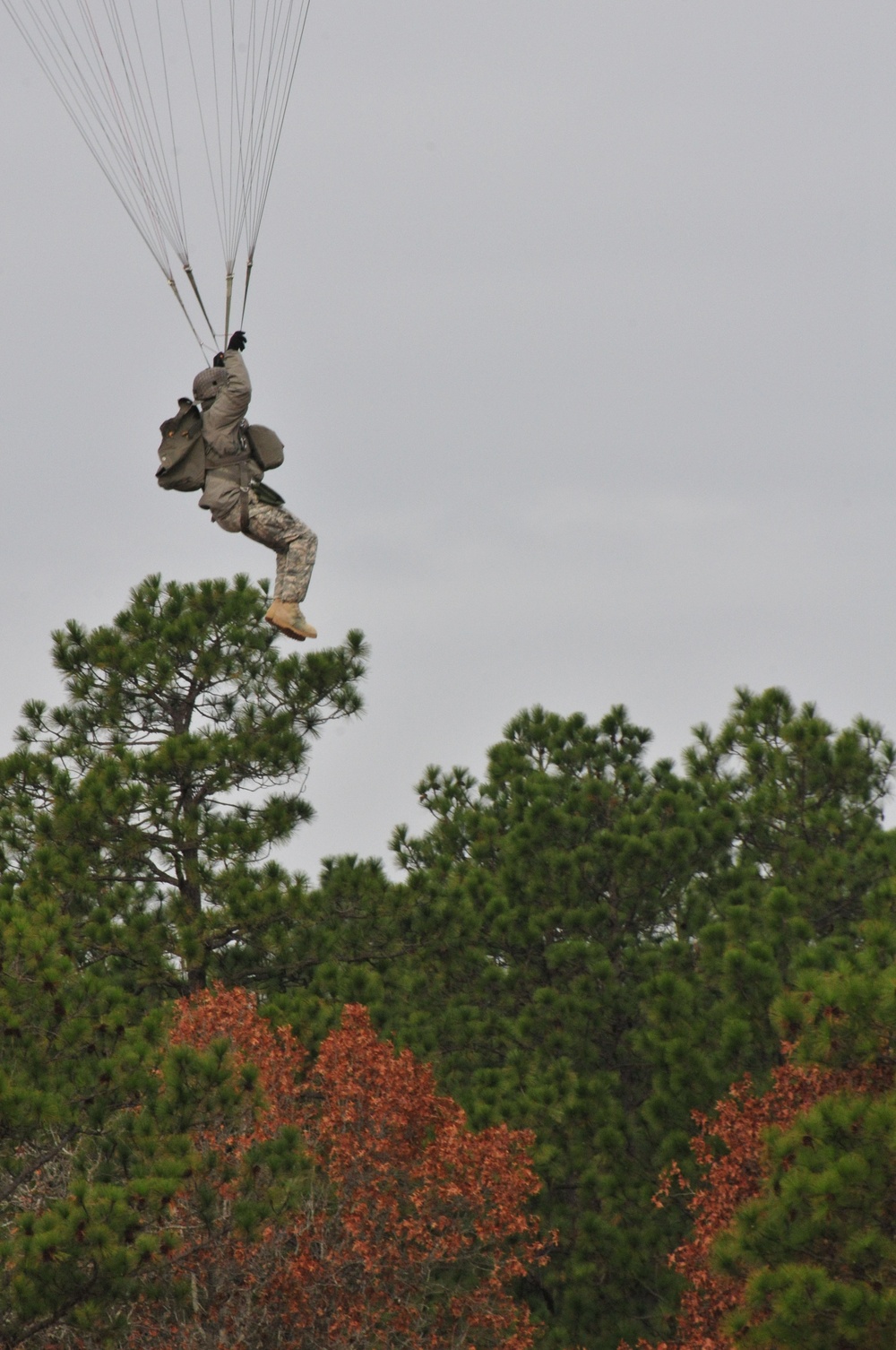 US Army paratrooper descends from aircraft