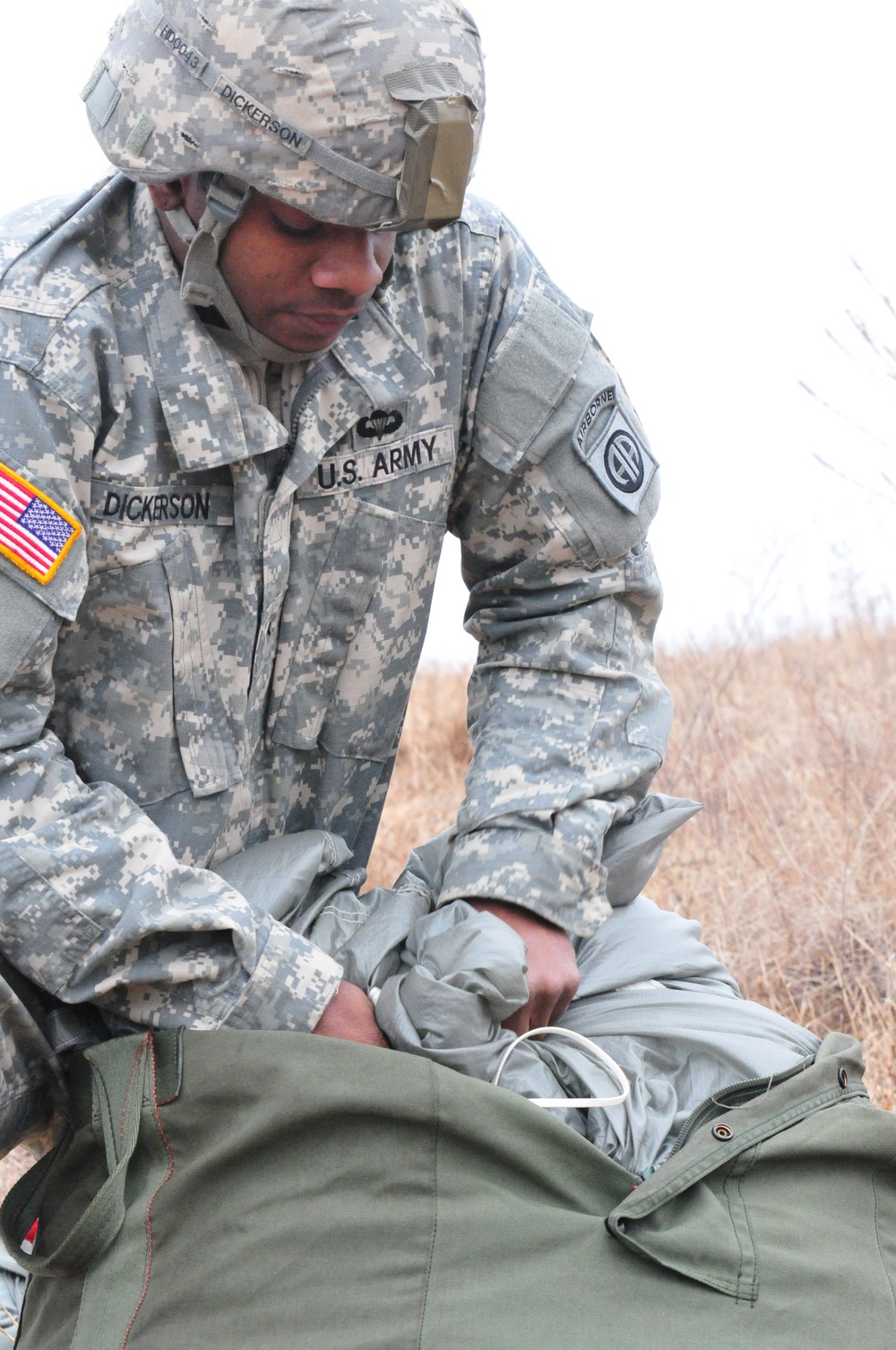 US Army Soldier recovers parachute