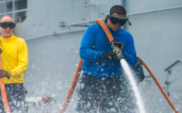 USS Peleliu conducts flight deck wash down