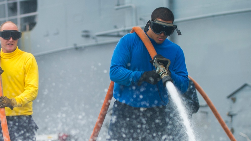 USS Peleliu conducts flight deck wash down