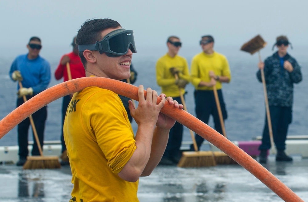 USS Peleliu conducts flight deck wash down