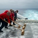 USS Peleliu conducts flight deck wash down