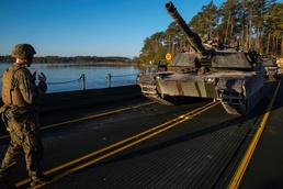Marine guides tank onto raft
