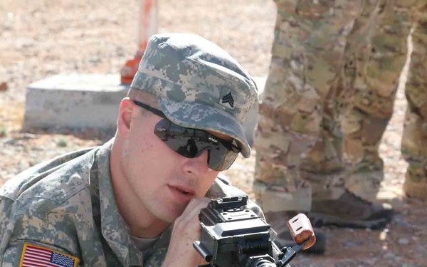 Highlander Soldier takes aim with a PKM