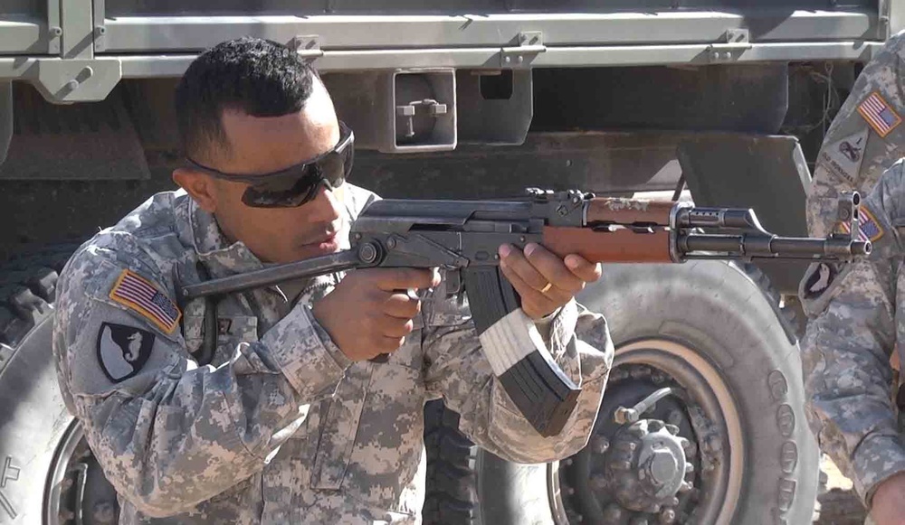 NCO takes aim with an AK-47 during training
