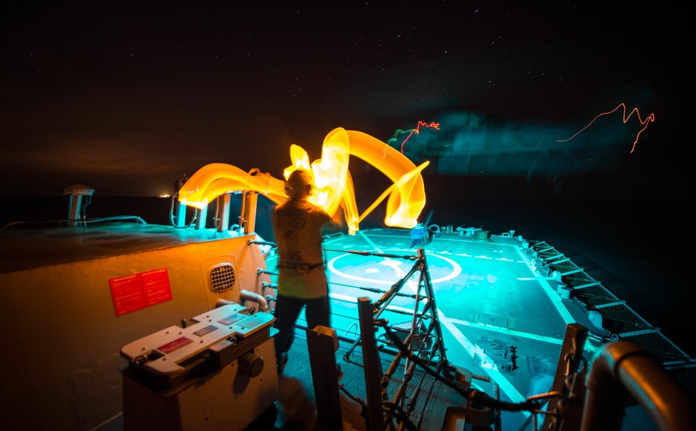 USS Mitscher conducts night delayed landing qualifications