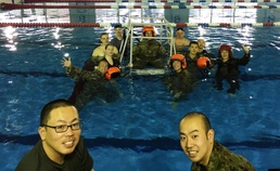 Bilateral students and trainers pose after training