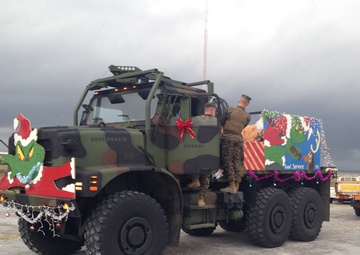 Kinser tree lighting ceremony, holiday parade endures rain