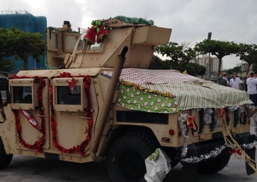 Kinser tree lighting ceremony, holiday parade endures rain