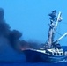 Crew members saved from burning ship