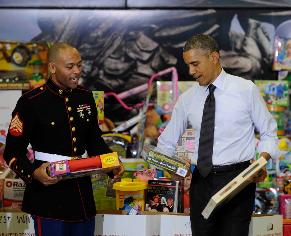President helps Marine sort through toy donations
