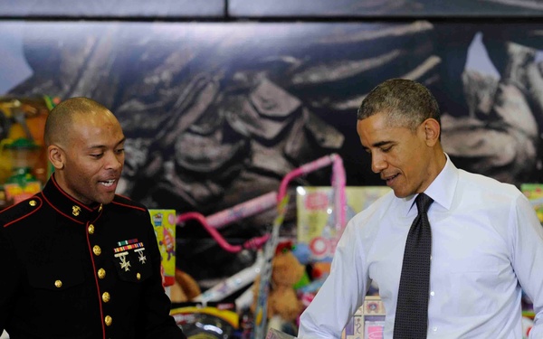President helps Marine sort through toy donations