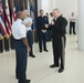 CNGB presents his coin to Airman