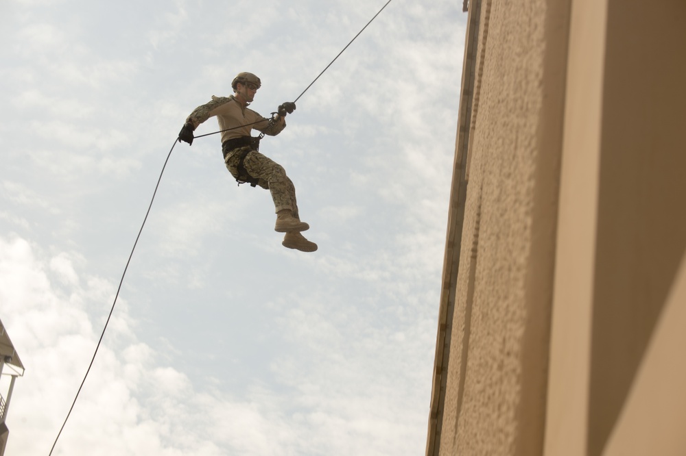 Commander, Task Group 56.1 EOD technicians rappelling