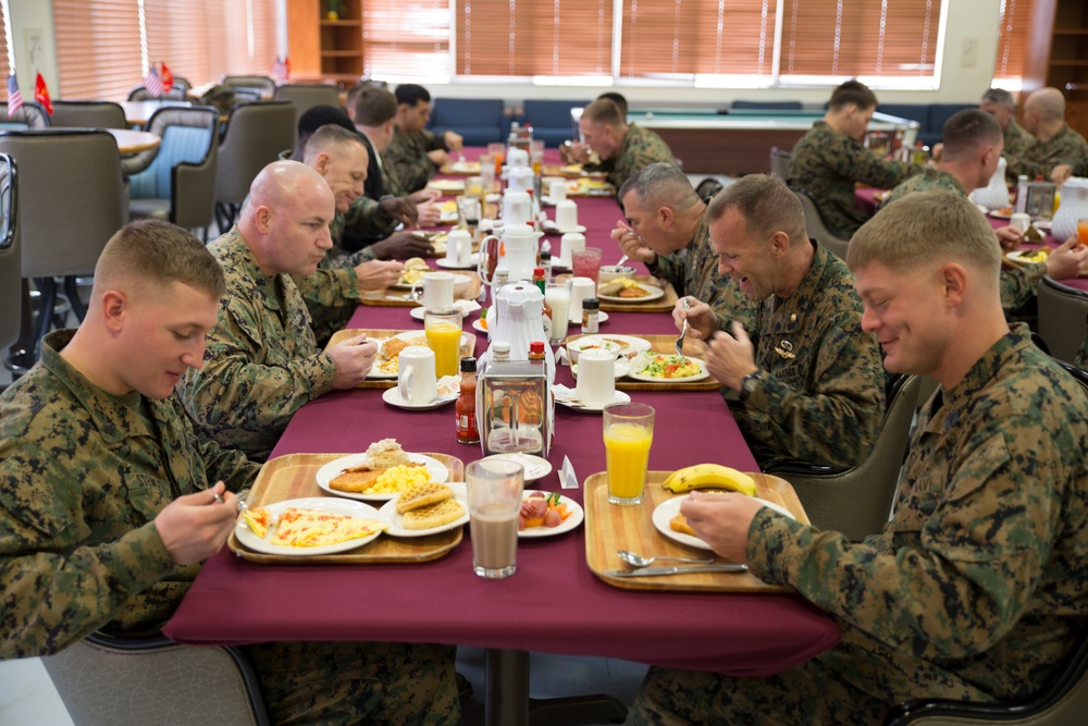 Senior Marines break bread with junior Marines on Okinawa