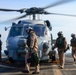 Sailors inspect an MH-60S Seahawk helicopter