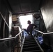 C-5 flight engineer descends stairs