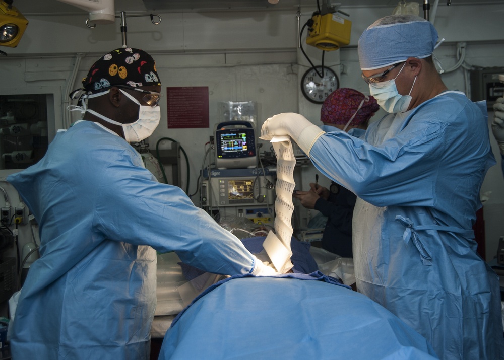USS Carl Vinson Sailors prepare for surgery