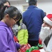 Santas surprise, celebrate Christmas with local kids