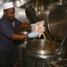 USS Sterett Sailors prepare dinner