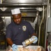 USS Sterett Sailors prepare dinner