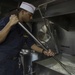 USS Dewey Sailor prepares dinner