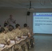 Marine recruits take notes during history class on Parris Island