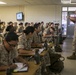 Marine recruits take notes during history class on Parris Island