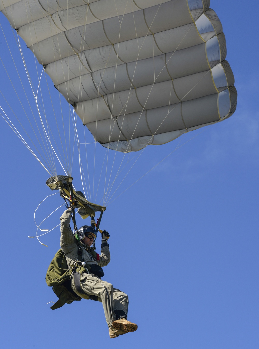 US Army airborne Soldier descends by parachute