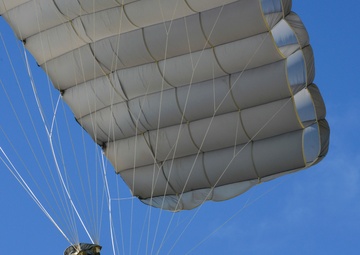 US Army airborne Soldier descends by parachute