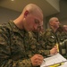Marine recruits take notes during history class on Parris Island