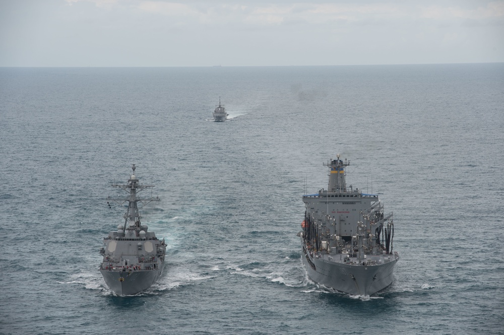 US Navy ships conduct replenishment-at-sea