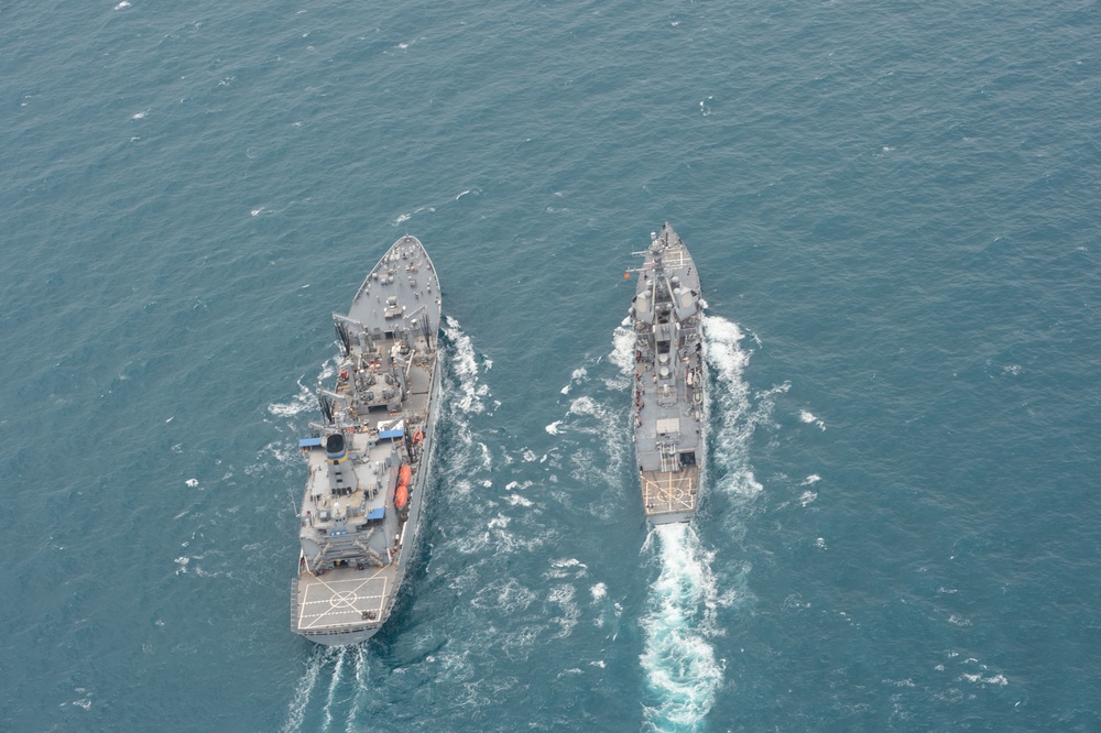 US Navy ships conduct replenishment-at-sea